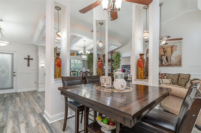 dining room featuring hardwood / wood-style floors, ceiling fan, and ornamental molding