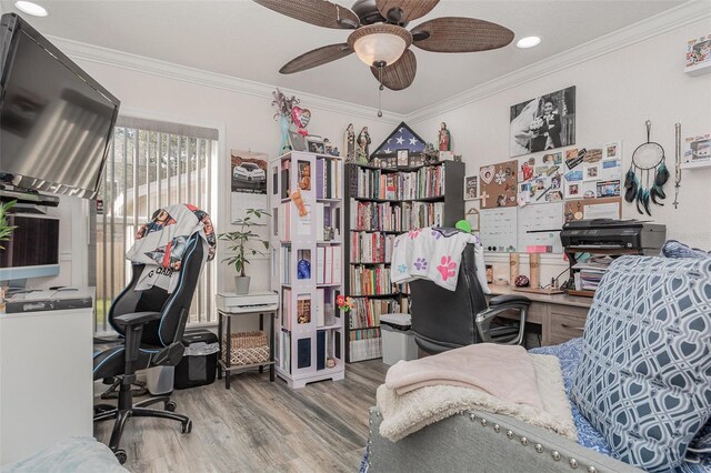 office area featuring crown molding, hardwood / wood-style floors, and ceiling fan