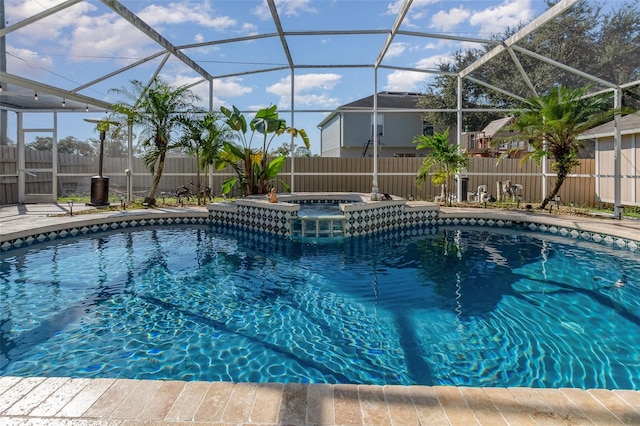 view of pool with glass enclosure and an in ground hot tub