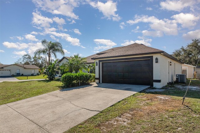 exterior space featuring a front yard and central AC