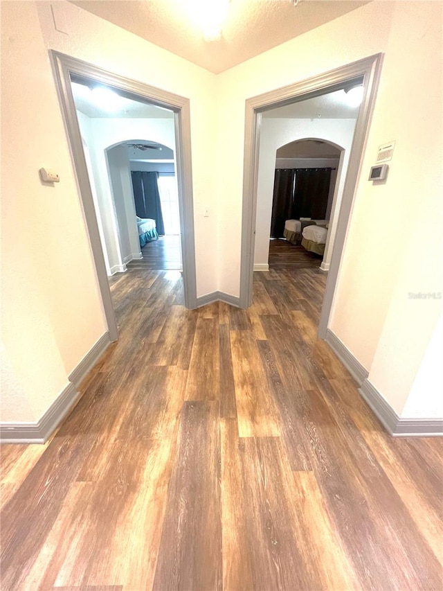 hall featuring dark wood-type flooring