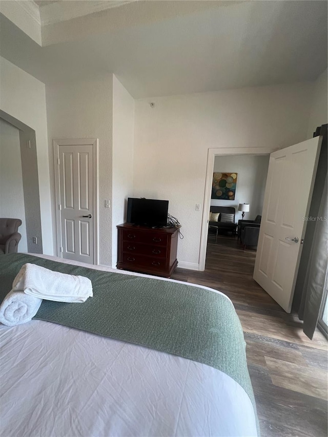 bedroom featuring dark wood-type flooring