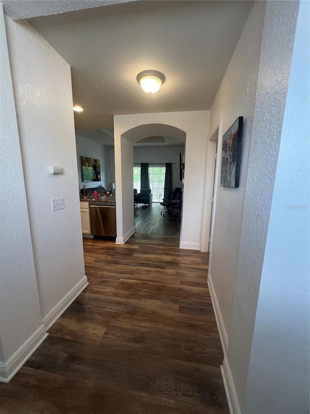 hall with dark hardwood / wood-style floors