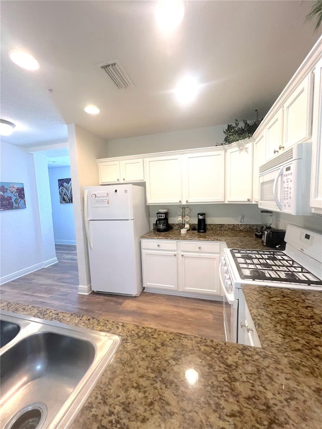 kitchen featuring light hardwood / wood-style floors, sink, white appliances, and white cabinetry