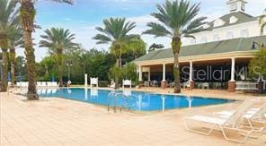 view of swimming pool with a patio