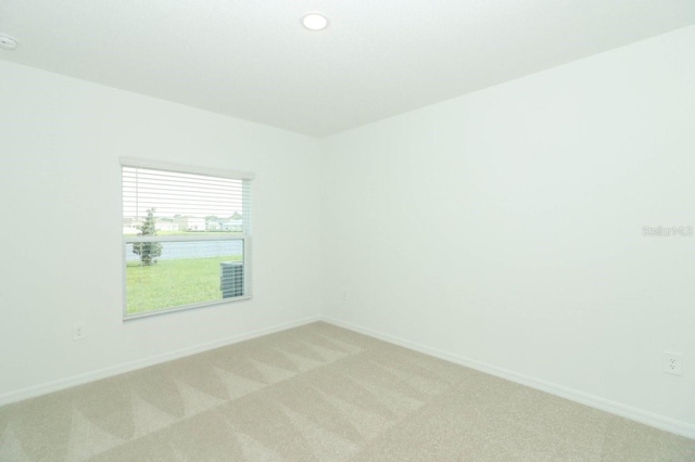 empty room with carpet flooring