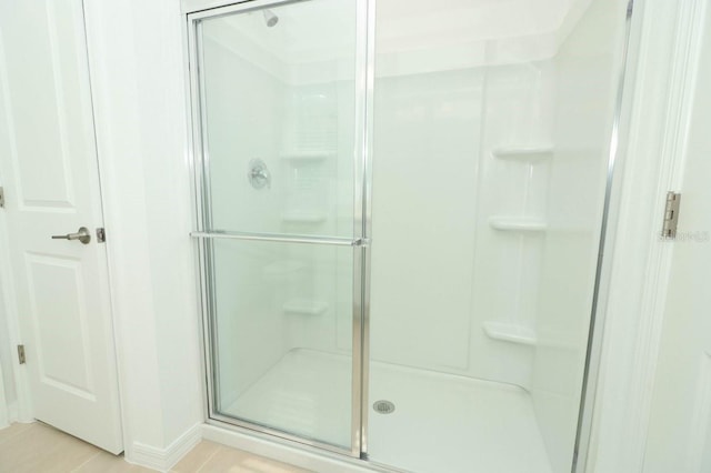 bathroom with an enclosed shower