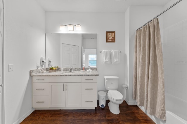 full bathroom featuring toilet, shower / tub combo with curtain, vanity, and wood-type flooring