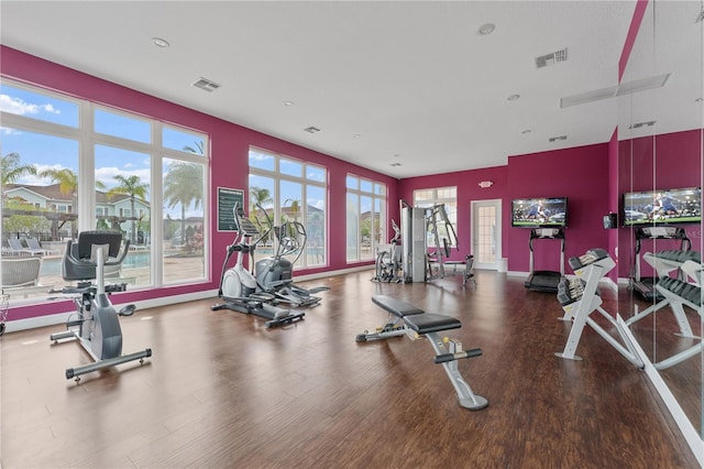 workout area with hardwood / wood-style floors