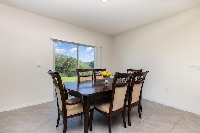 dining room with light tile patterned flooring