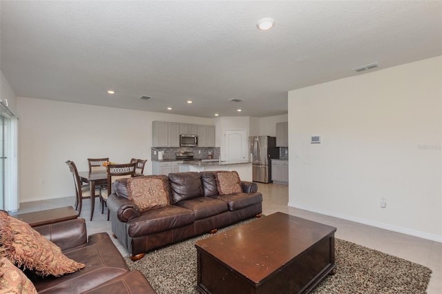 living room featuring a textured ceiling