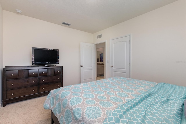 bedroom featuring light colored carpet