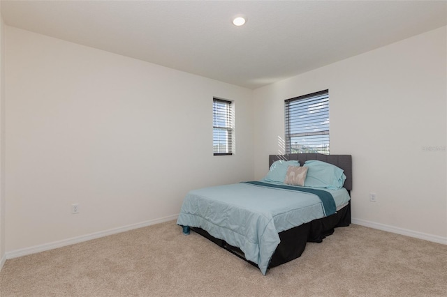 bedroom with light carpet