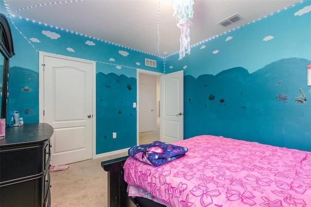 carpeted bedroom featuring a textured ceiling