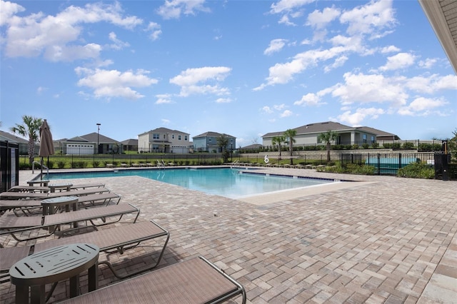 view of swimming pool with a patio area