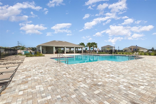 view of swimming pool featuring a patio area