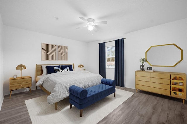 bedroom featuring dark hardwood / wood-style flooring and ceiling fan