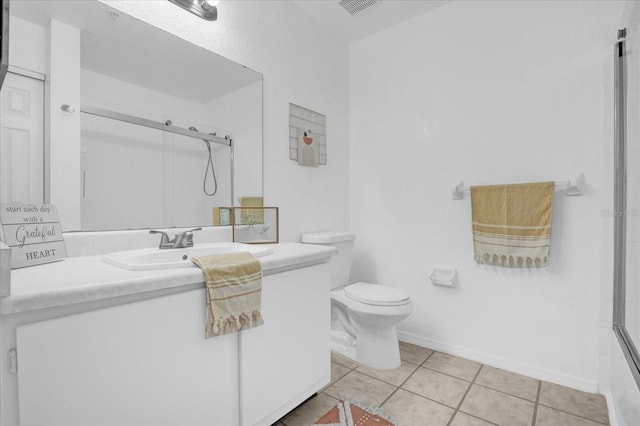 bathroom featuring an enclosed shower, toilet, tile patterned flooring, and vanity