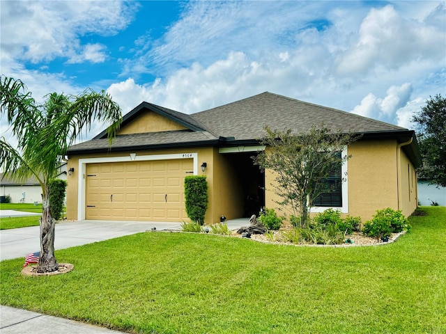 view of front of house featuring a front lawn and a garage