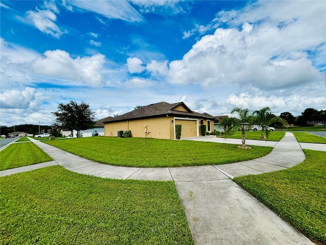 view of home's exterior featuring a garage and a yard