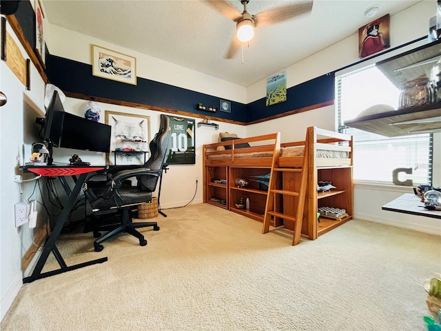 bedroom with ceiling fan and carpet