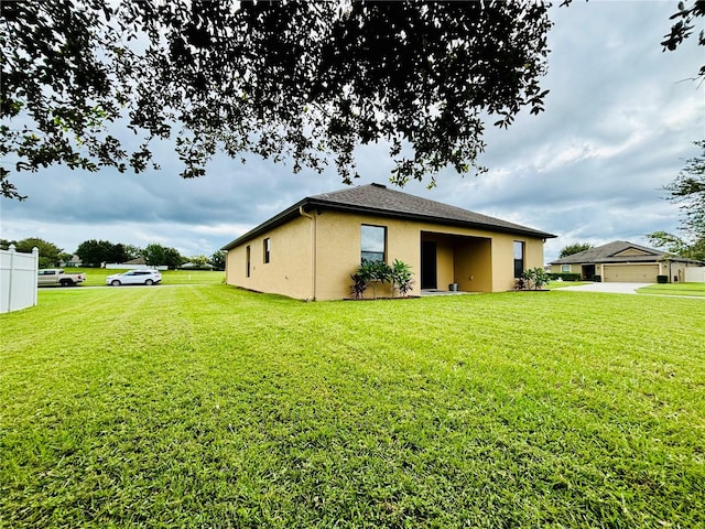 view of property exterior with a yard