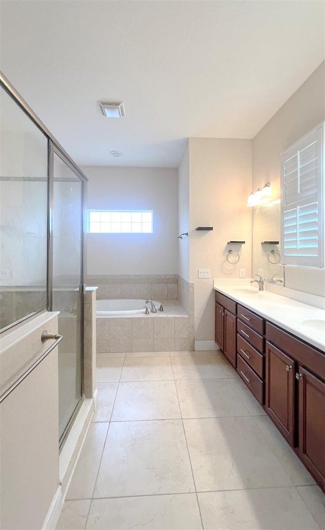 bathroom with vanity, tile patterned floors, and independent shower and bath