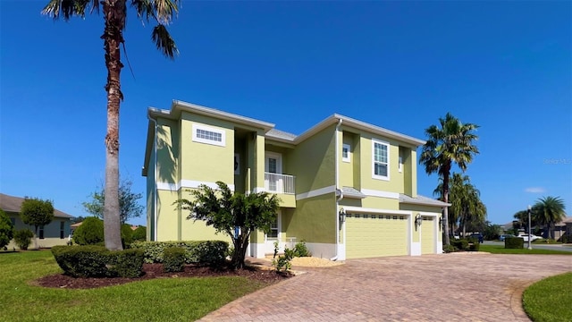 view of front of home featuring a garage and a front lawn