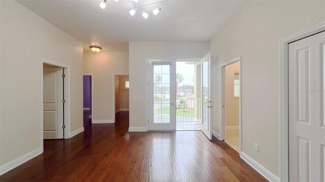 doorway to outside featuring dark hardwood / wood-style flooring and french doors