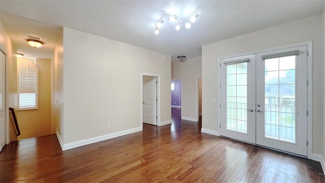 interior space featuring hardwood / wood-style floors, a wealth of natural light, and french doors