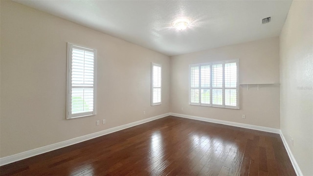 empty room featuring dark hardwood / wood-style floors