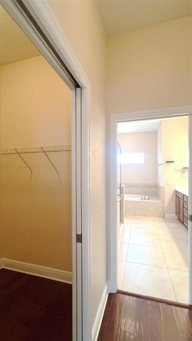 hallway featuring light tile patterned floors