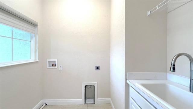 laundry area with light tile patterned floors, washer hookup, sink, and electric dryer hookup