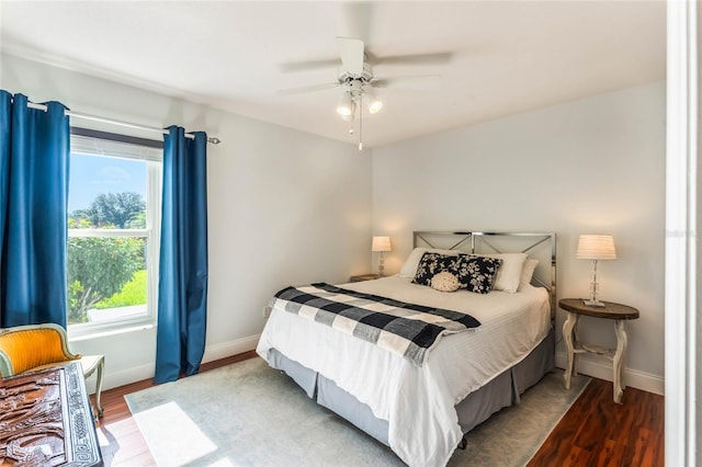 bedroom featuring wood-type flooring and ceiling fan