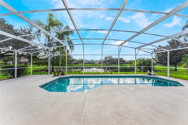 view of pool featuring a patio, a water view, and glass enclosure