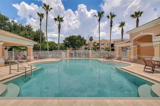 view of pool featuring a patio