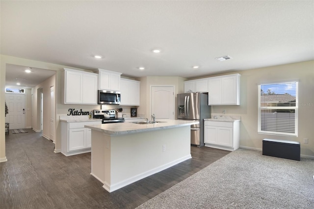 kitchen featuring dark wood-type flooring, appliances with stainless steel finishes, and white cabinets