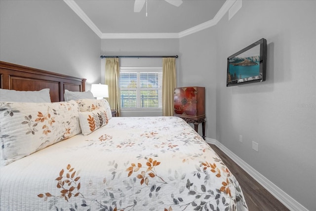 bedroom featuring crown molding, ceiling fan, and dark hardwood / wood-style floors