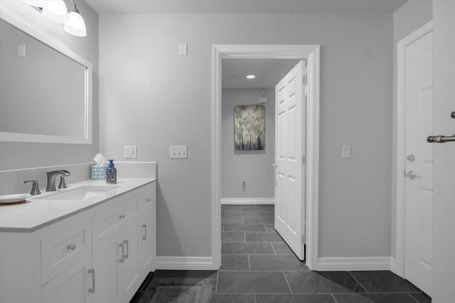 bathroom with tile patterned floors and vanity