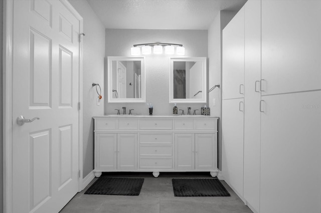 bathroom featuring vanity and a textured ceiling