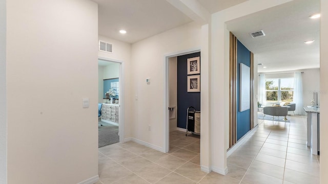 hallway with light tile patterned floors