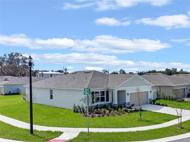 ranch-style home with a front yard and a garage