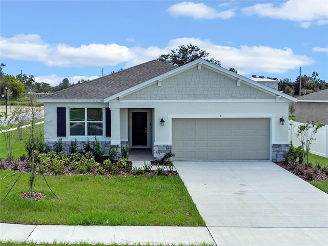 craftsman inspired home featuring a front lawn and a garage