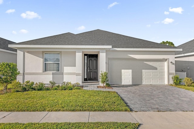 ranch-style house with a front yard and a garage