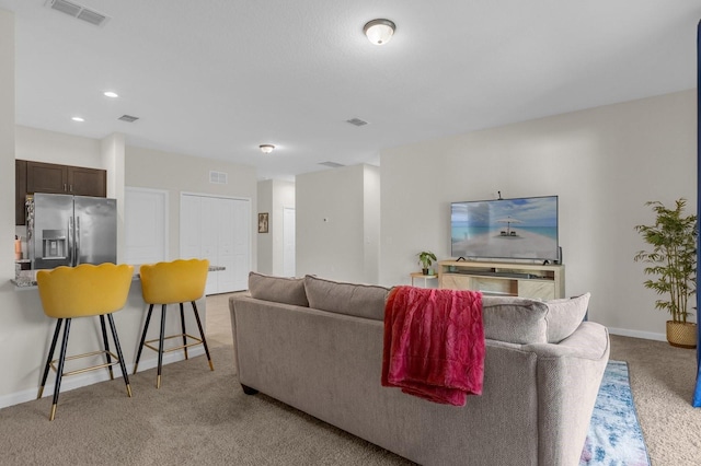 living room featuring light colored carpet