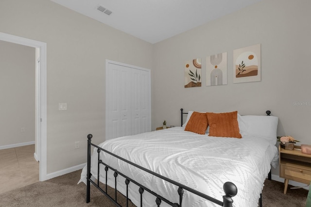 carpeted bedroom featuring a closet