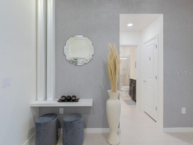 hallway with light tile patterned floors