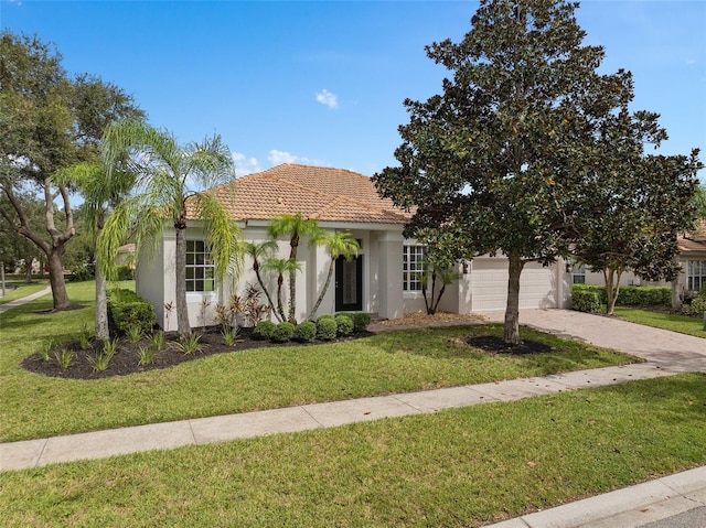 view of front of home featuring a garage and a front yard