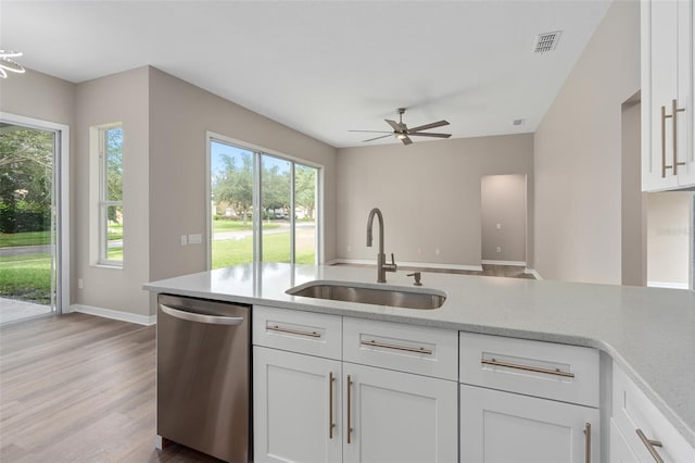 kitchen with dishwasher, sink, and a wealth of natural light