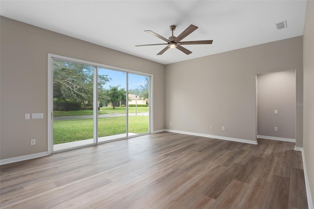 spare room featuring ceiling fan and wood-type flooring